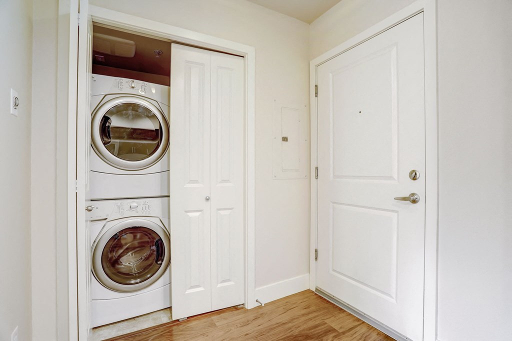 a small laundry room with a washer and dryer in it