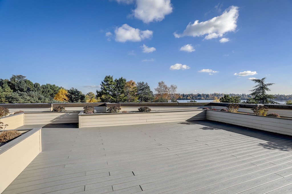 the view from the roof of a building with a blue sky
