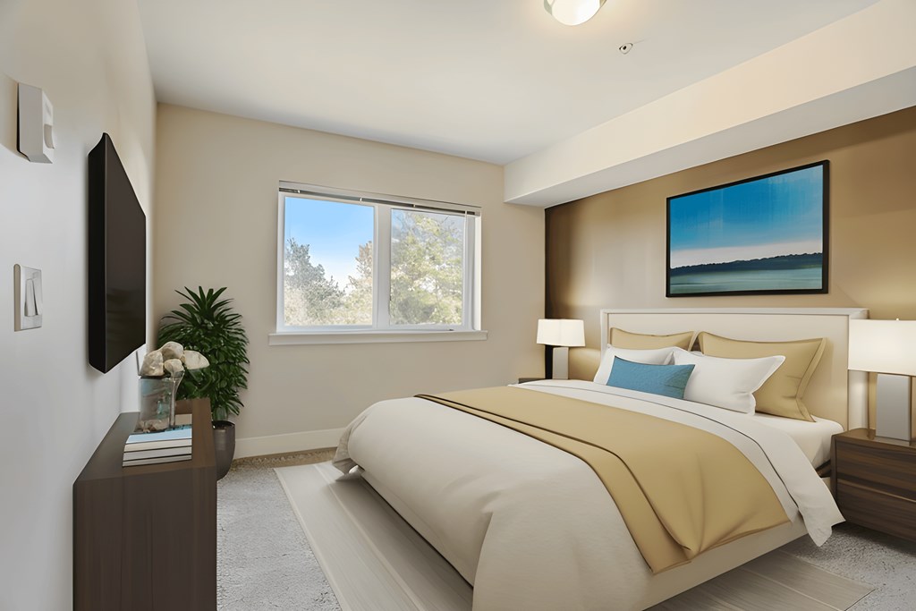 a bedroom with a bed and a tv