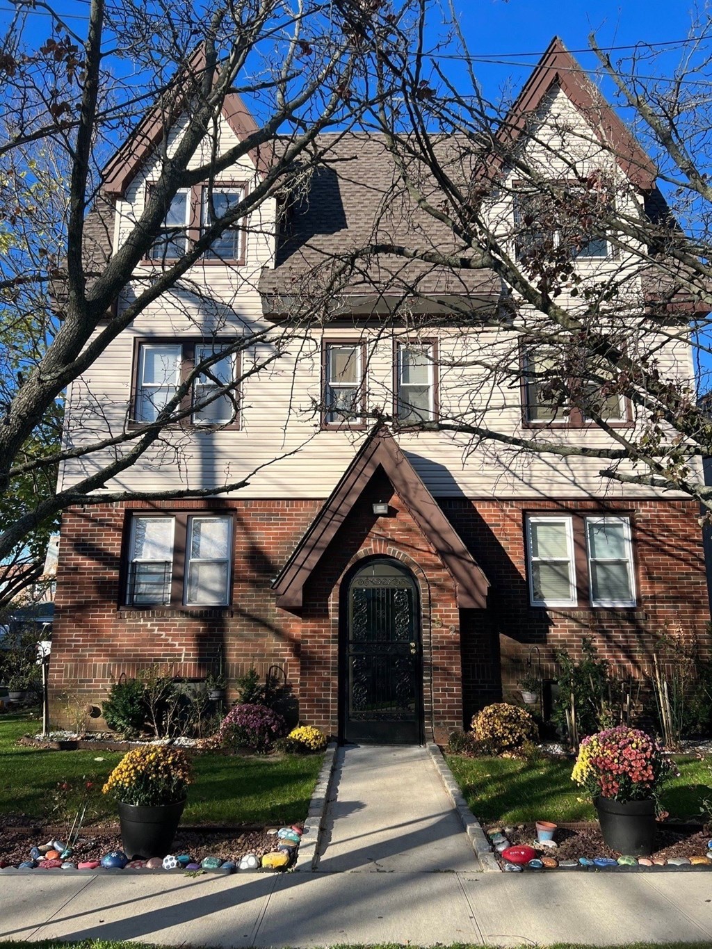 A large house with a black door and windows.