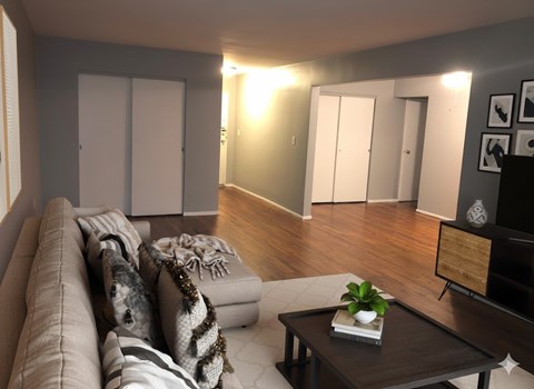 A living room with a brown couch and a coffee table.