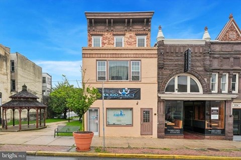 A building with a gazebo in front of it.