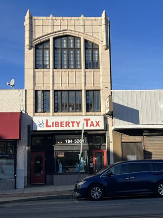 the facade of liberty tax in front of a tall building
