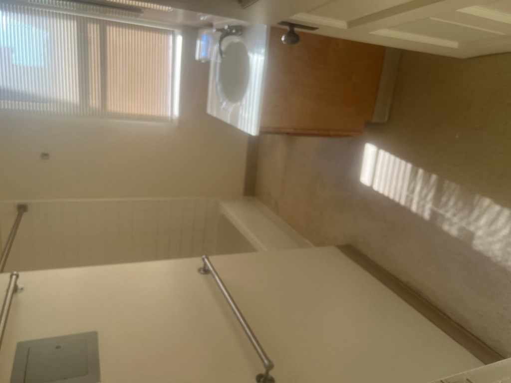 a bathroom with a sink and a tub and a window