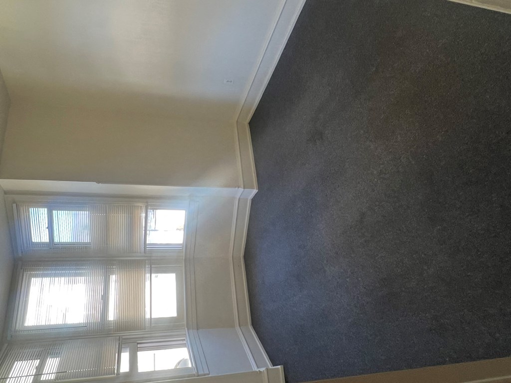 the view from the top of the stairs looking up at the window