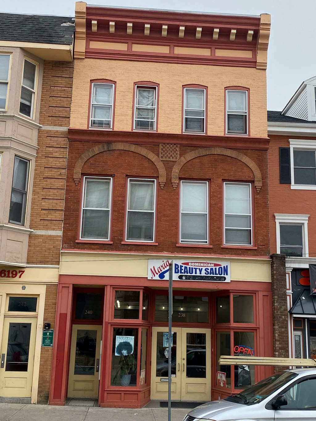 A building with a salon on the ground floor.