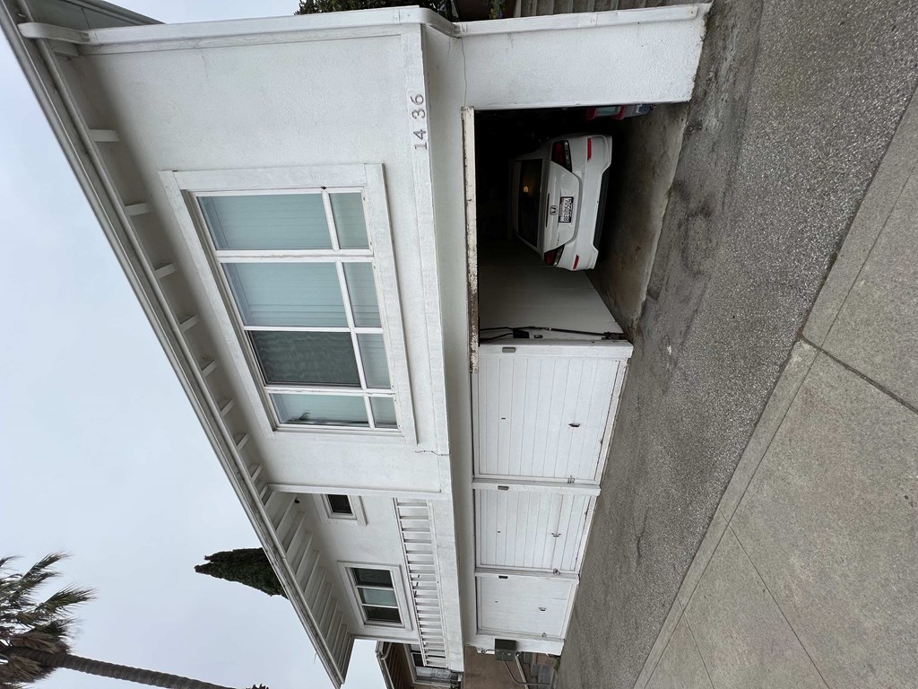 a view of the side of a building with an open door