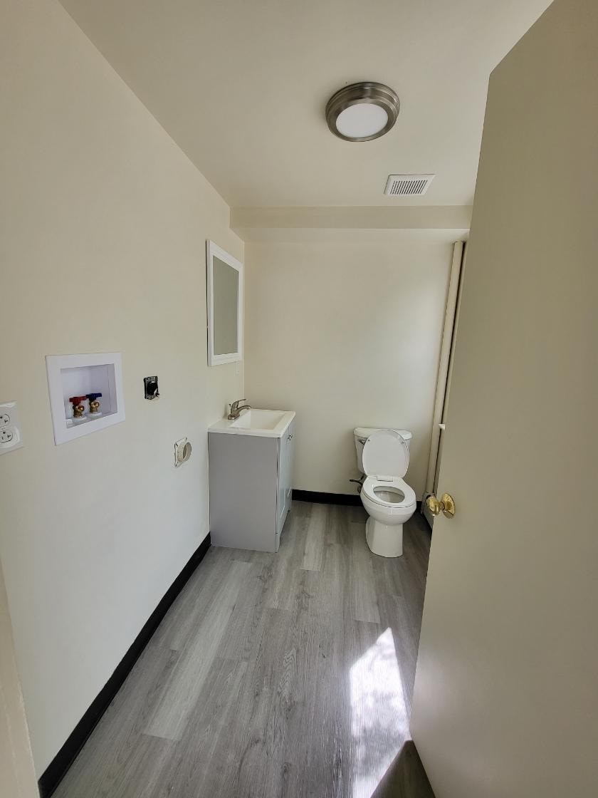 a bathroom with a toilet and a sink