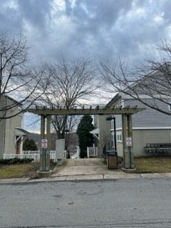 the entrance to a building with a covered porch