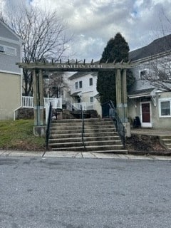 a large wooden archway in front of a house