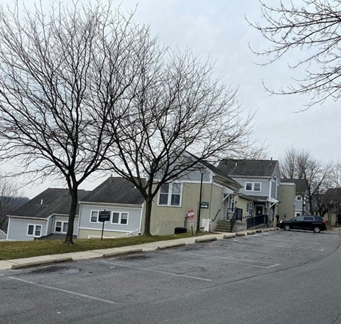 a row of houses on the side of a street