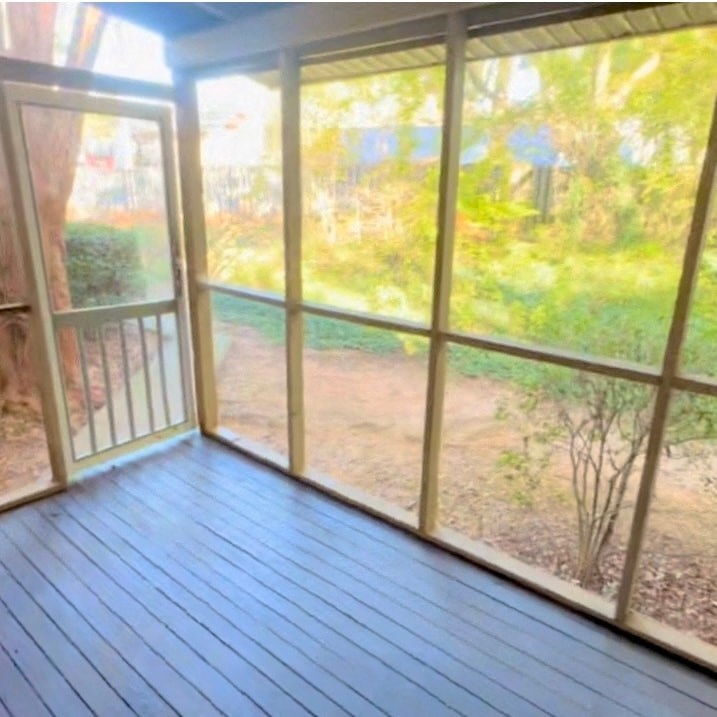 A sunny day in the garden through the glass door.