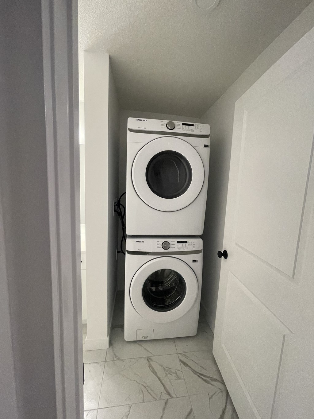 a washer and dryer in a small laundry room