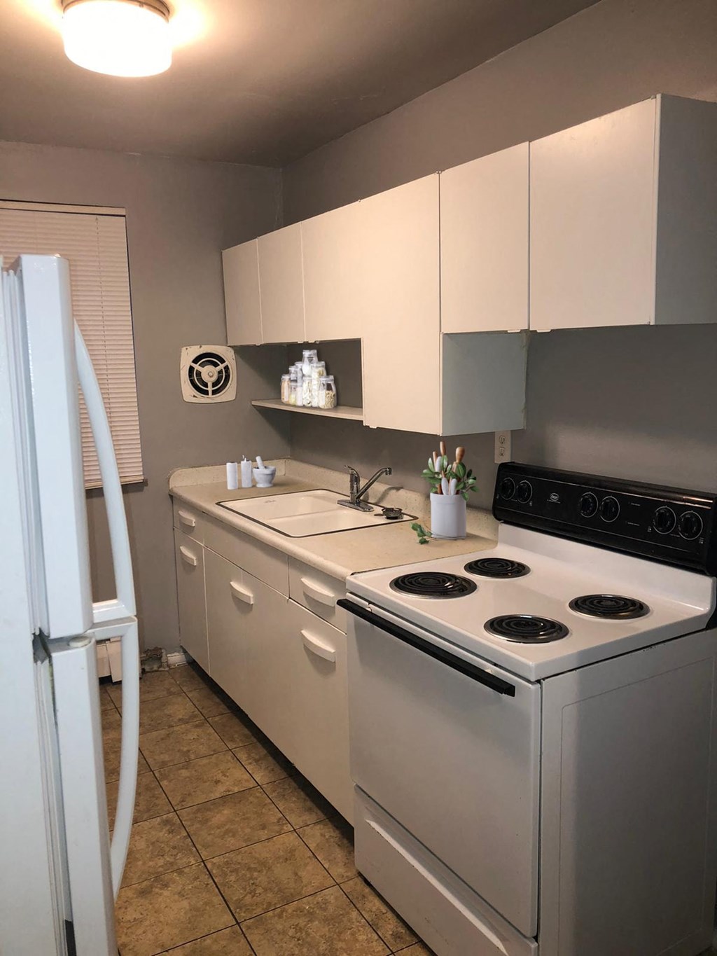 a kitchen with a stove and a sink