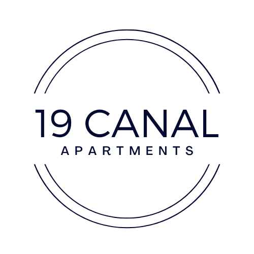 a black circle with the words 19 canal apartments