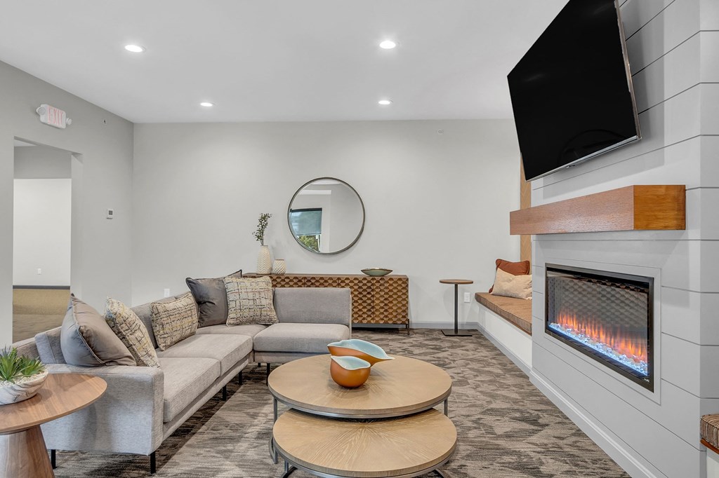 a living room with couches and a fireplace