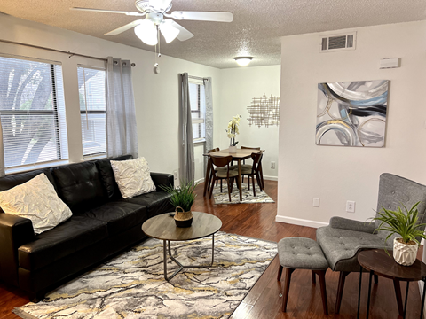 an open living room and dining room with a couch and a table