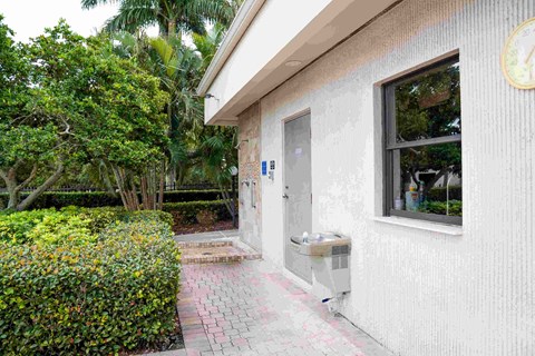 A white building with a window and a door.