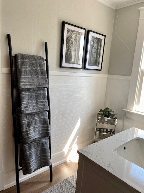 a towel rack in a bathroom next to a tub
