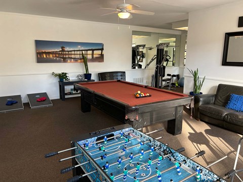 a game room with a pool table and a foosball