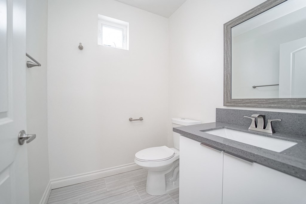 an empty bathroom with a toilet and a sink