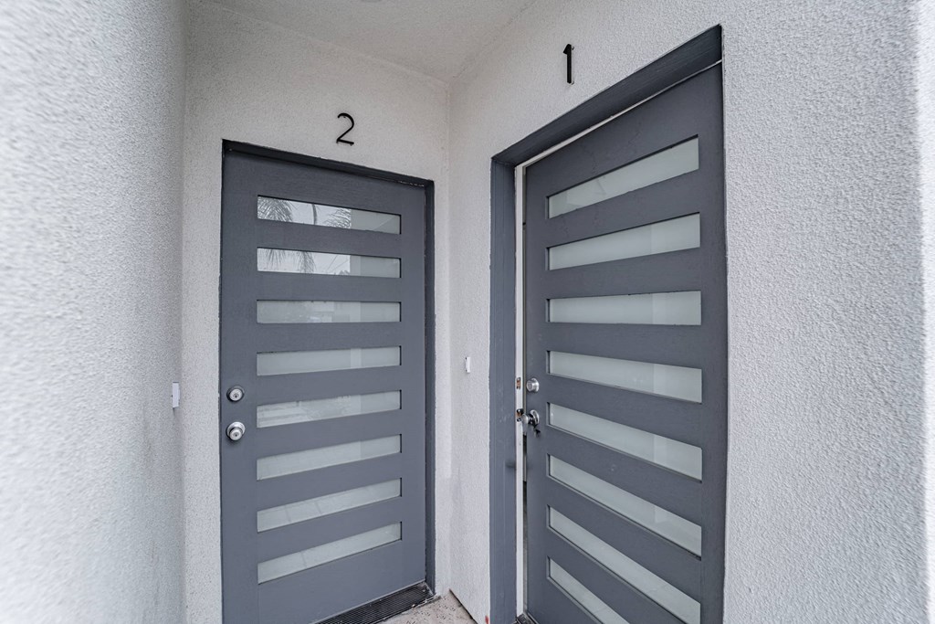 the front door of a house with two doors