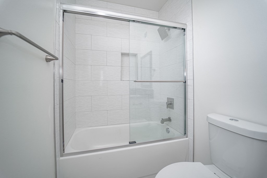 a small bathroom with a shower and a toilet