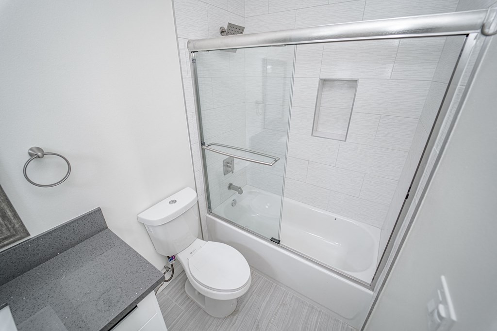a small bathroom with a shower and a toilet