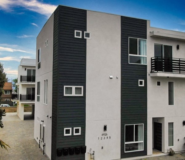 a tall apartment building with black and white walls