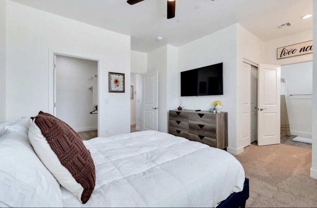 Furnished bedroom shown at Camelback Townhomes.
