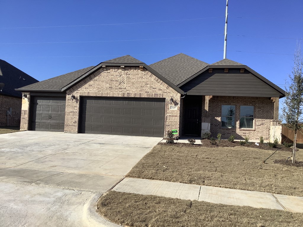 a house with a driveway and a garage door