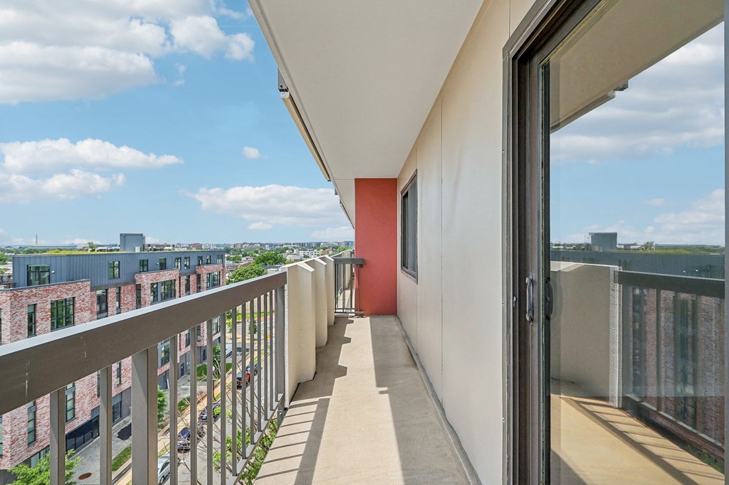 a balcony with a view of the city