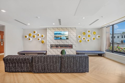 a living room with couches and a fireplace