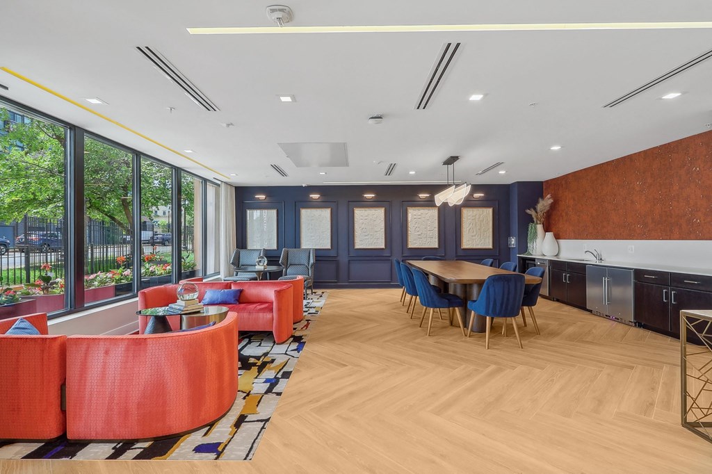 a living room with blue walls and a table and chairs
