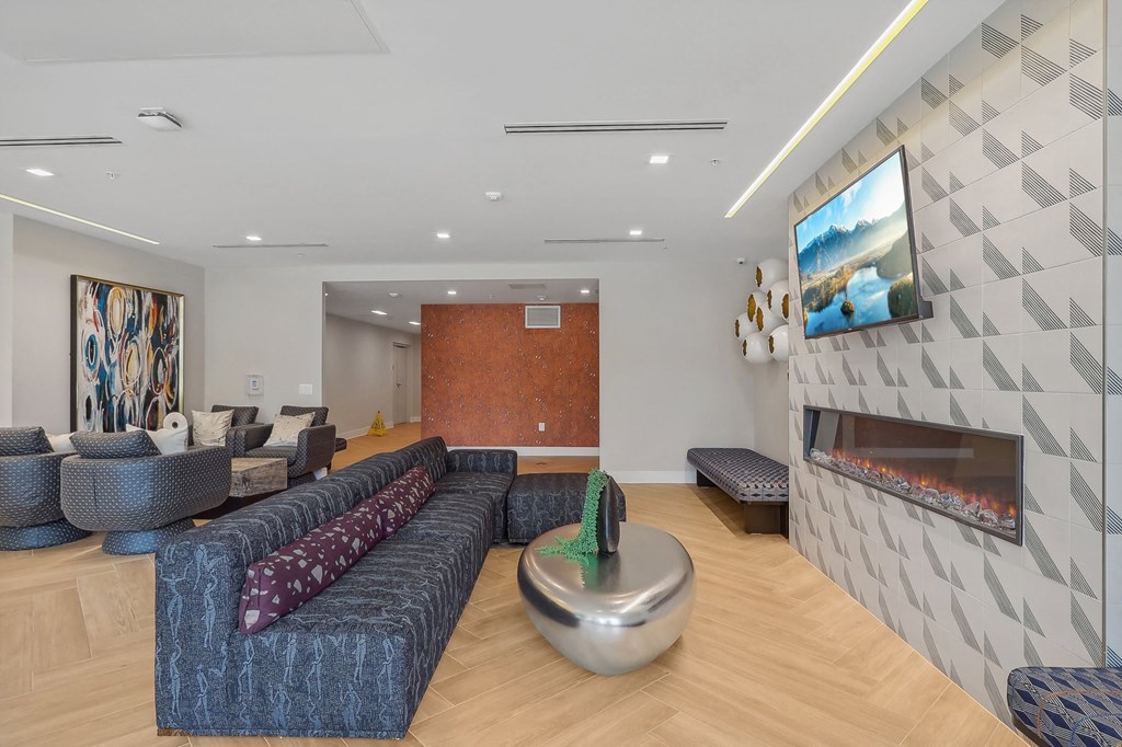 a living room with couches and a fireplace