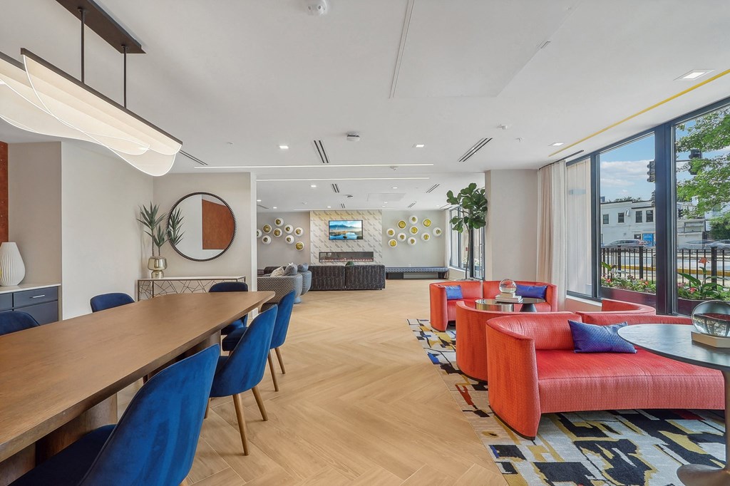 a living room with couches and chairs and a table