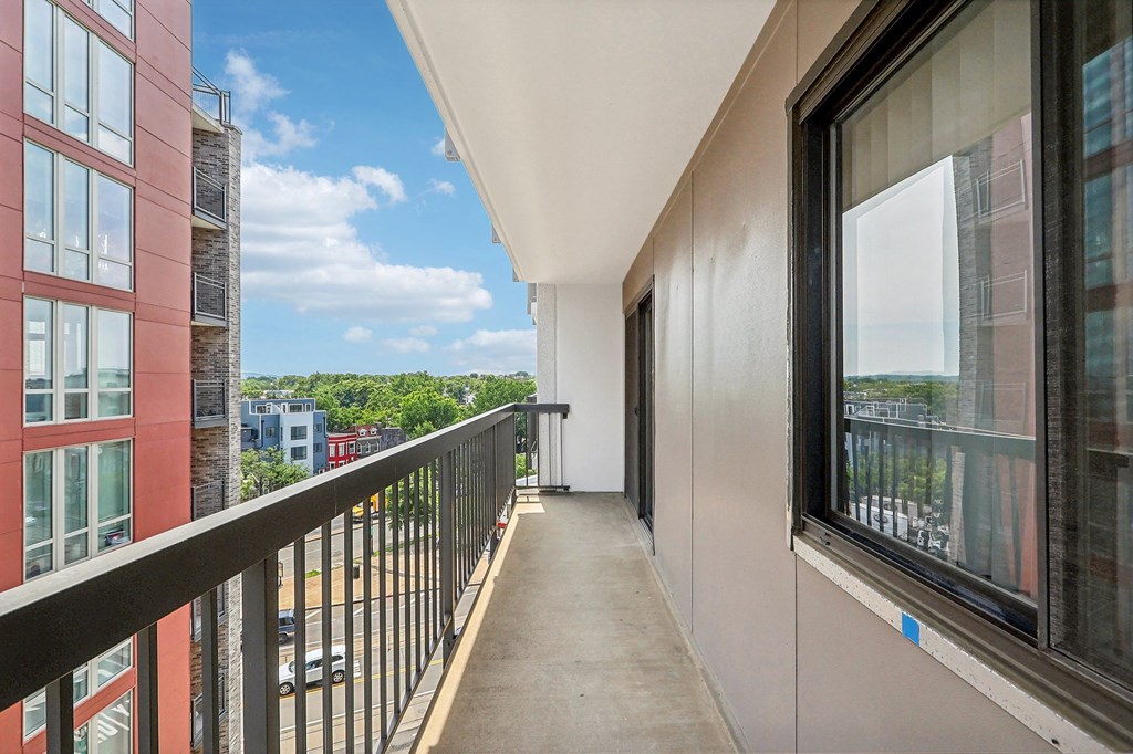 a view of the city from a balcony of a building