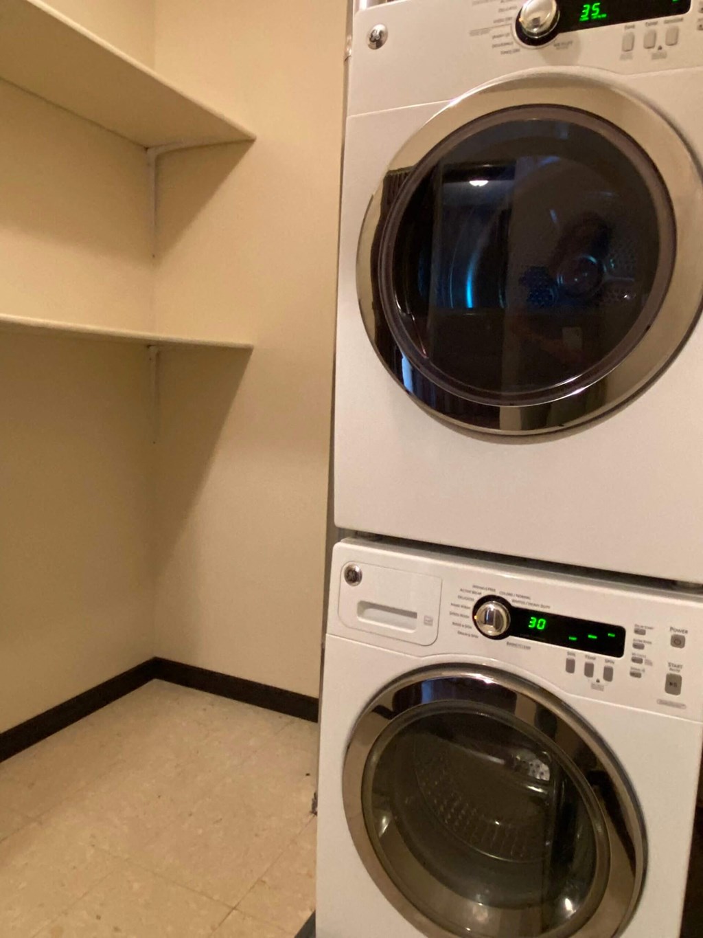 A washing machine with a digital display showing 30.