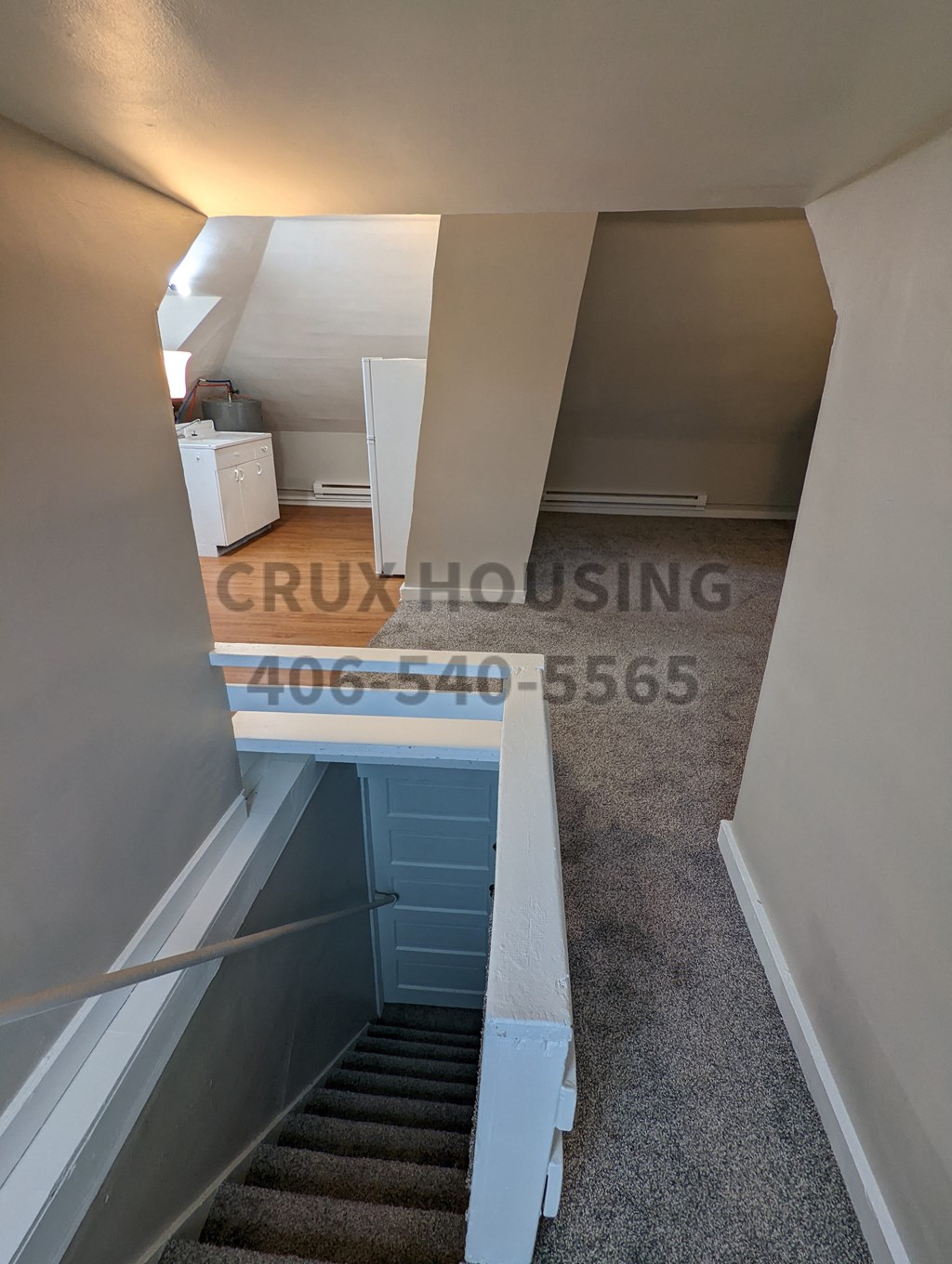 a view down the stairs from the top of a staircase