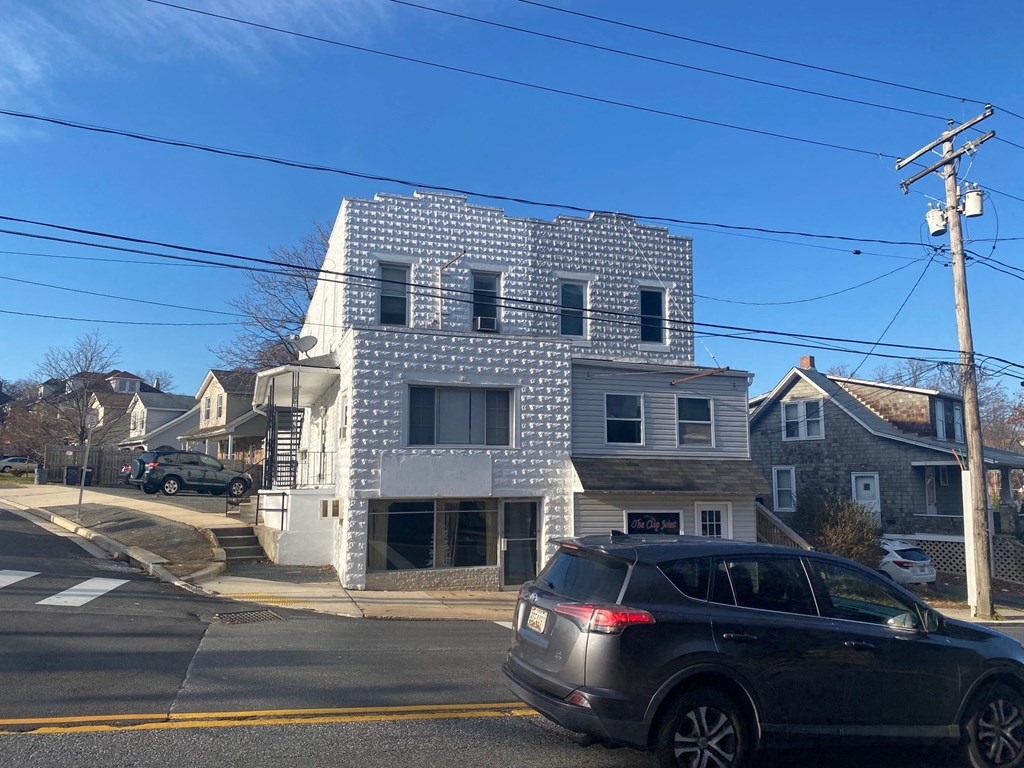 a building with a checkered facade on a city street