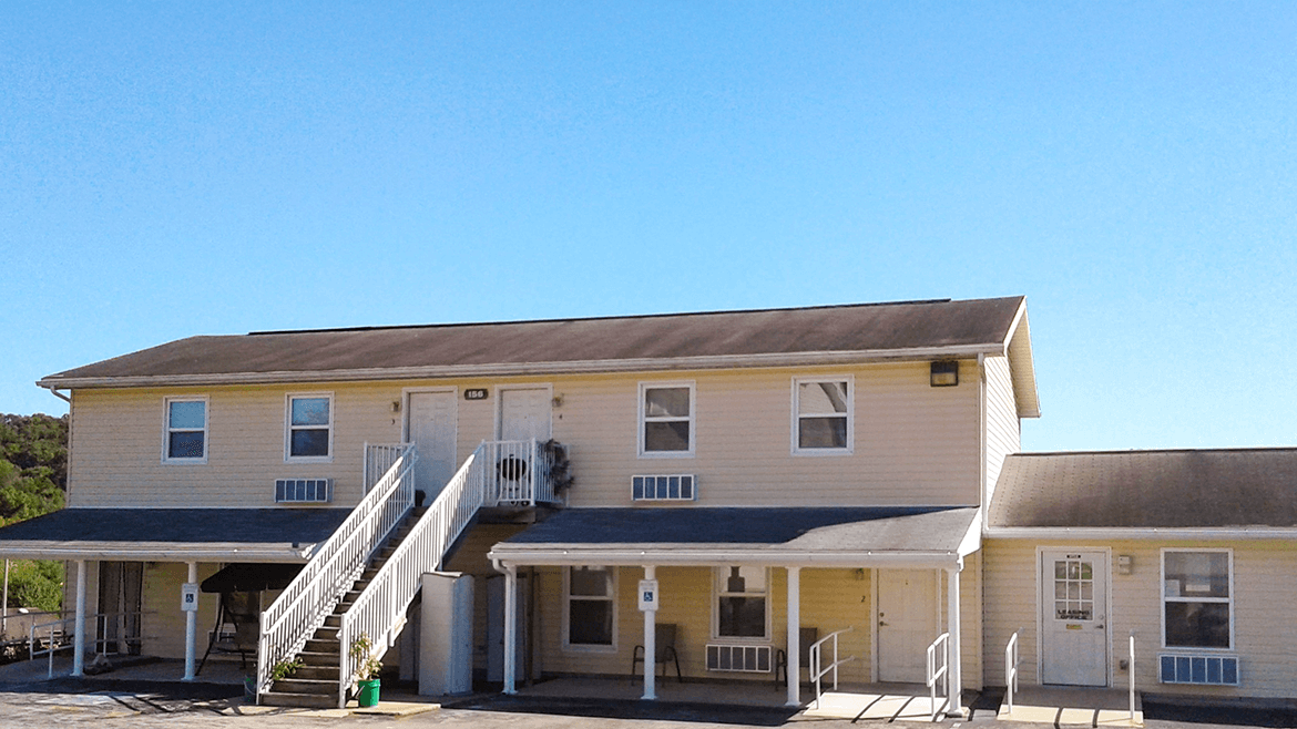 A two-story house with a staircase leading to the second floor.