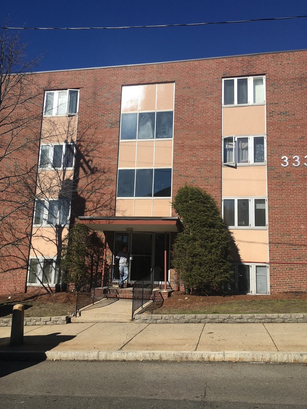 a brick building with a staircase in front of it