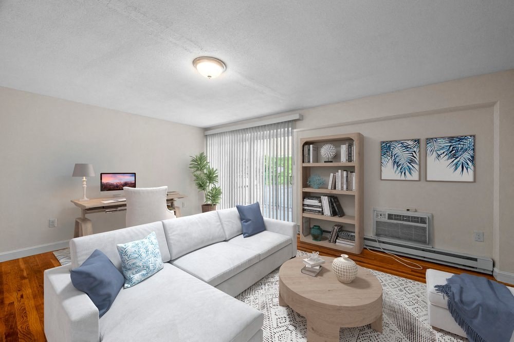 a living room with a white couch and a coffee table