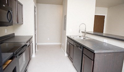 a kitchen with stainless steel counter tops and a sink