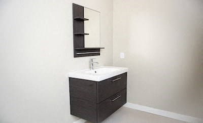 a bathroom with a sink and a mirror