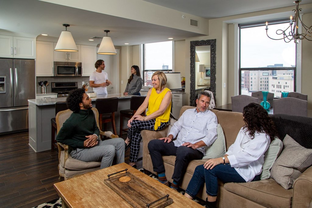 a group of people sitting in a living room