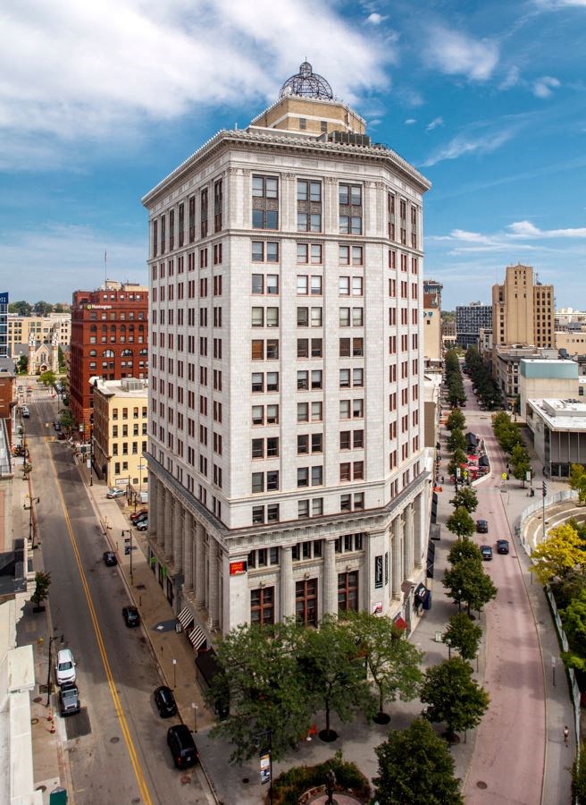 a view from above of a tall building in a city