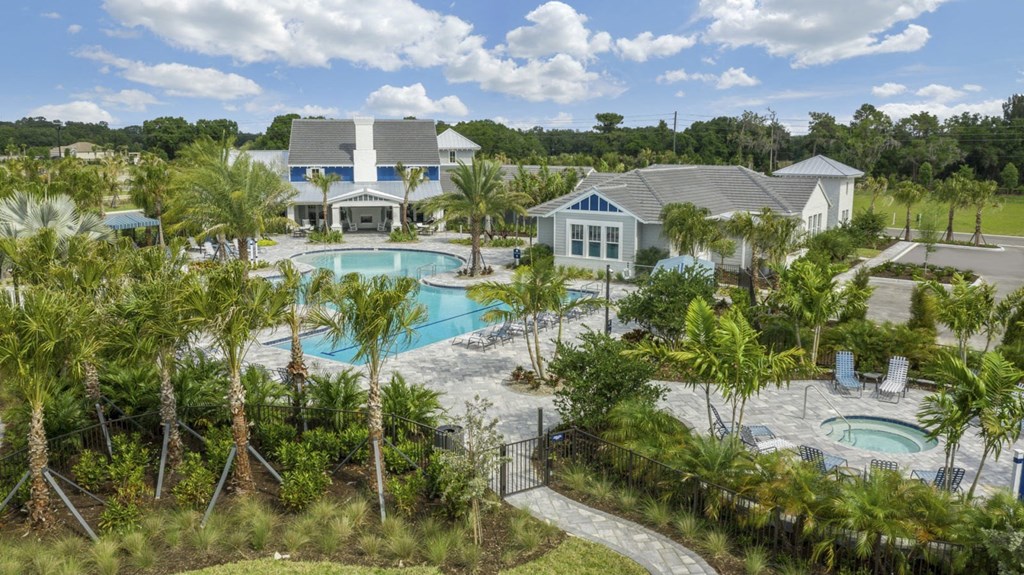 a aerial view of the resort with pools and buildings