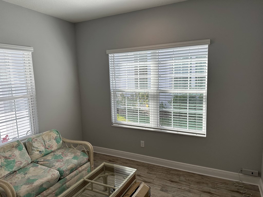 a living room with a couch and a glass table