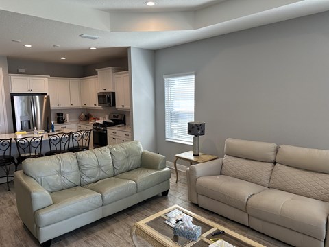 a living room with couches and a coffee table
